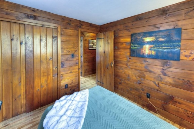 bedroom with wooden walls