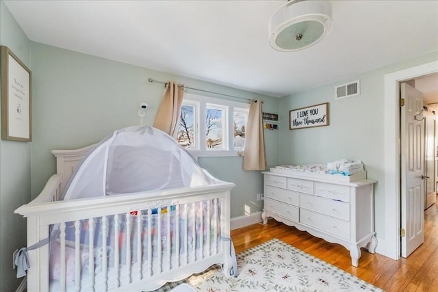 bedroom featuring hardwood / wood-style flooring