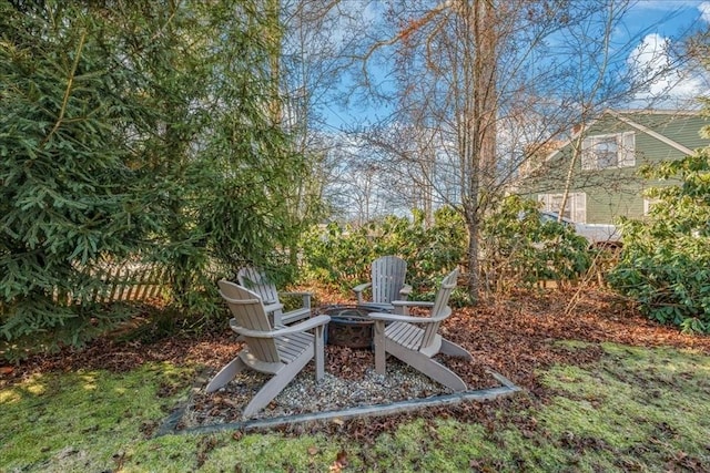 view of yard featuring an outdoor fire pit