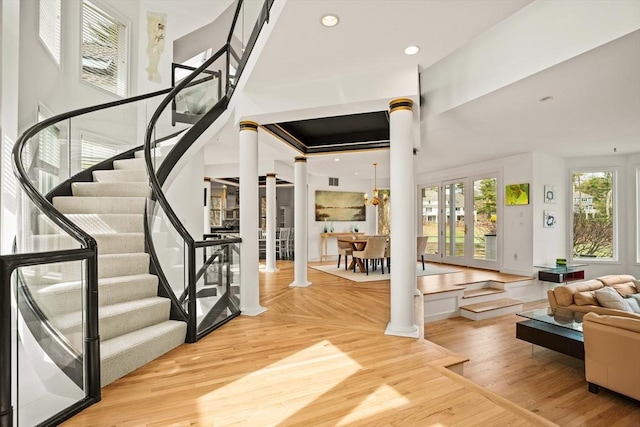 44 Southpoint Ln, Ipswich, MA 01938 - entryway featuring ornate columns, stairway, wood finished floors, and recessed lighting