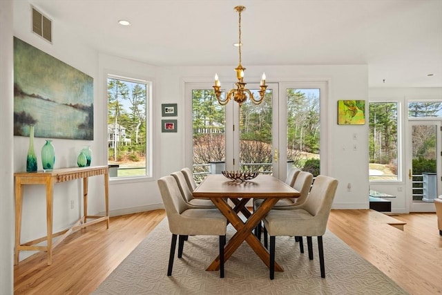 44 Southpoint Ln, Ipswich, MA 01938 - dining room with a chandelier, light wood finished floors, plenty of natural light, and recessed lighting