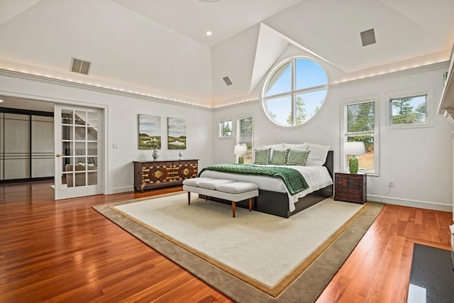 44 Southpoint Ln, Ipswich, MA 01938 - bedroom with wood finished floors, french doors, and high vaulted ceiling