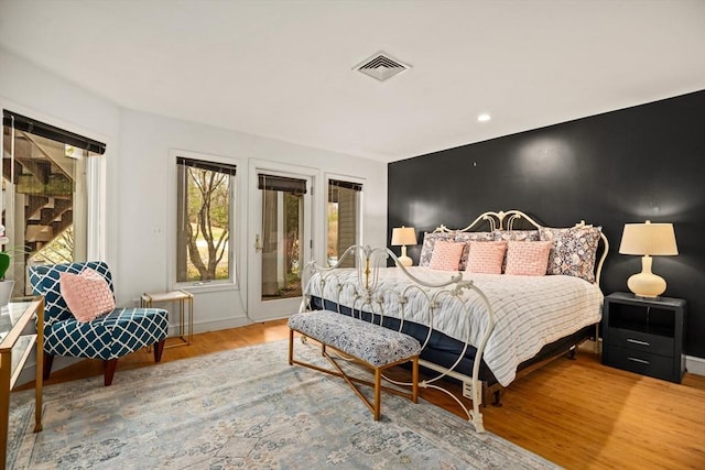 44 Southpoint Ln, Ipswich, MA 01938 - bedroom with access to outside and wood finished floors