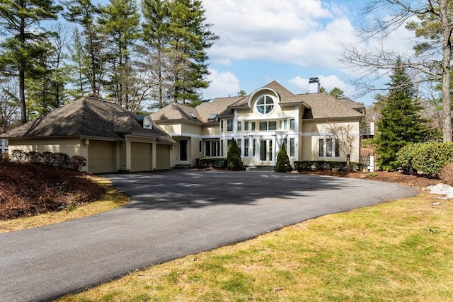 44 Southpoint Ln, Ipswich, MA 01938 - view of front of home with asphalt driveway and a chimney