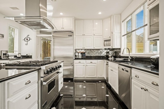 44 Southpoint Ln, Ipswich, MA 01938 - kitchen featuring appliances with stainless steel finishes, island exhaust hood, dark countertops, white cabinets, and recessed lighting