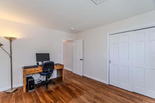 home office with baseboards and wood finished floors