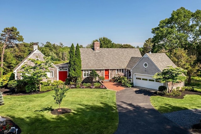 view of front facade featuring a garage and a front yard