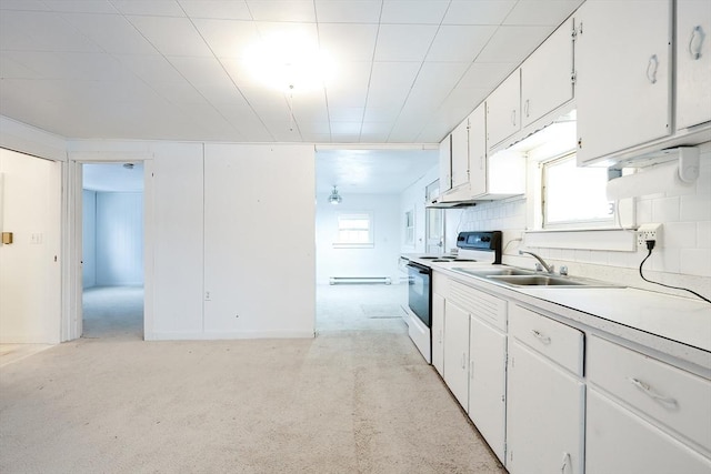 kitchen featuring white cabinetry, sink, a wealth of natural light, and white electric stove