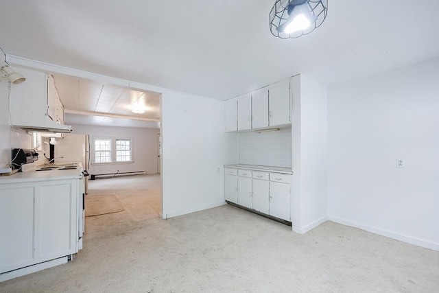 interior space with white electric range, a baseboard radiator, and white cabinets