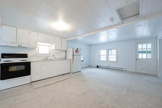 kitchen featuring plenty of natural light, range with electric cooktop, white cabinets, and white refrigerator