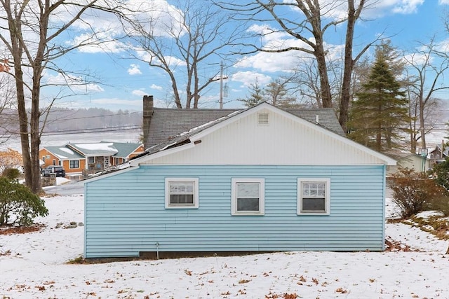 view of snow covered property