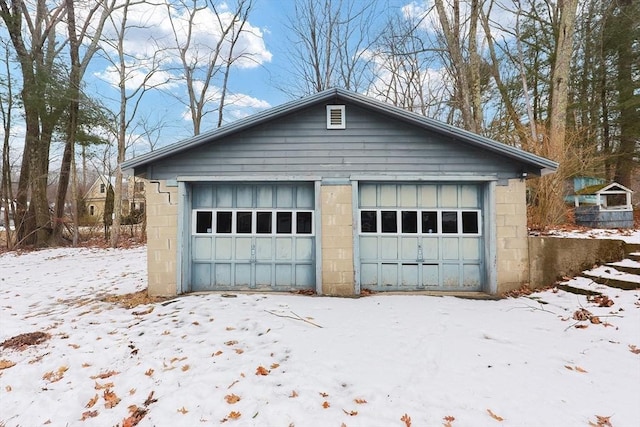 view of snow covered garage