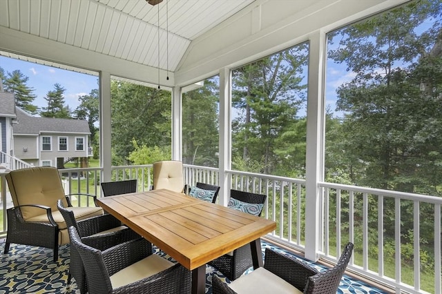 sunroom / solarium with lofted ceiling