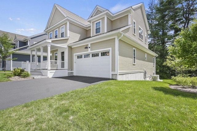 view of front of property with driveway, a porch, and a front yard