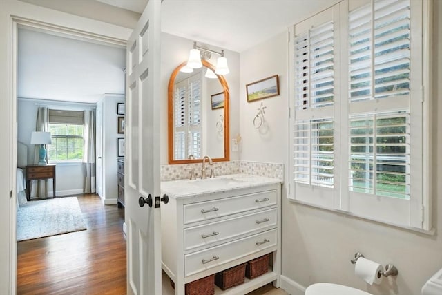 22 Partridge Rd, Duxbury, MA 02332 - half bathroom with wood finished floors, baseboards, and vanity