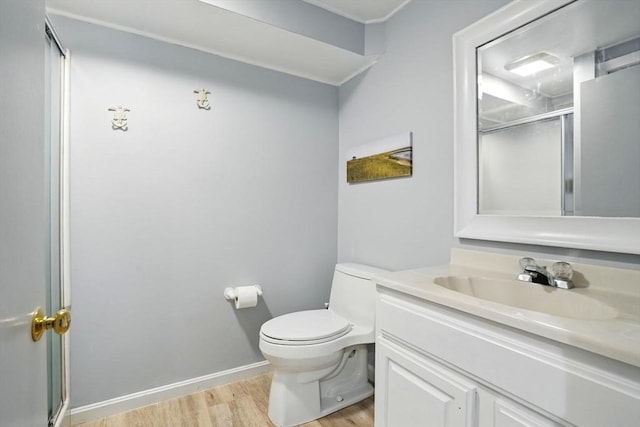 22 Partridge Rd, Duxbury, MA 02332 - full bathroom with wood finished floors, a shower stall, vanity, toilet, and baseboards