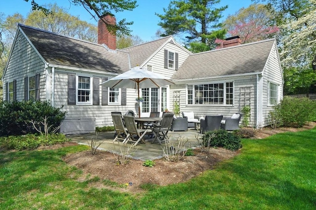 22 Partridge Rd, Duxbury, MA 02332 - rear view of house with a chimney, a yard, a patio, roof with shingles, and an outdoor living space