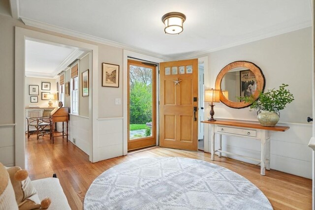 22 Partridge Rd, Duxbury, MA 02332 - entryway featuring ornamental molding, wood finished floors, and wainscoting