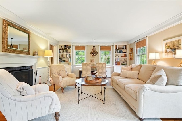 22 Partridge Rd, Duxbury, MA 02332 - living area with built in shelves, ornamental molding, a fireplace, and light wood-style floors
