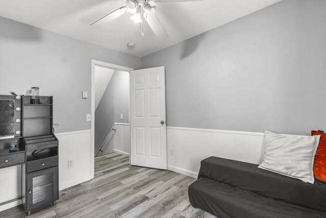 11 Broad St Unit 11, Hardwick, MA 01005 - sitting room featuring an upstairs landing, ceiling fan, wood finished floors, and a wainscoted wall