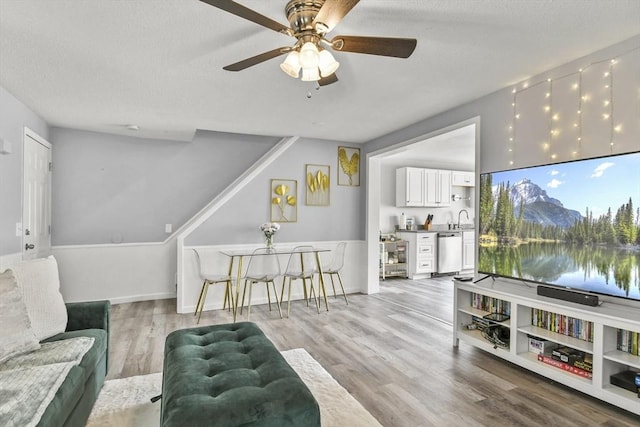 11 Broad St Unit 11, Hardwick, MA 01005 - living room featuring ceiling fan, light wood-style floors, and a textured ceiling