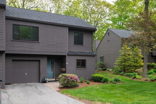 401 Colonial Dr Unit 35, Ipswich, MA 01938 - view of front of home with a garage, roof with shingles, a front lawn, and driveway