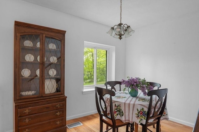 401 Colonial Dr Unit 35, Ipswich, MA 01938 - dining space with a chandelier, light wood-style floors, and healthy amount of natural light