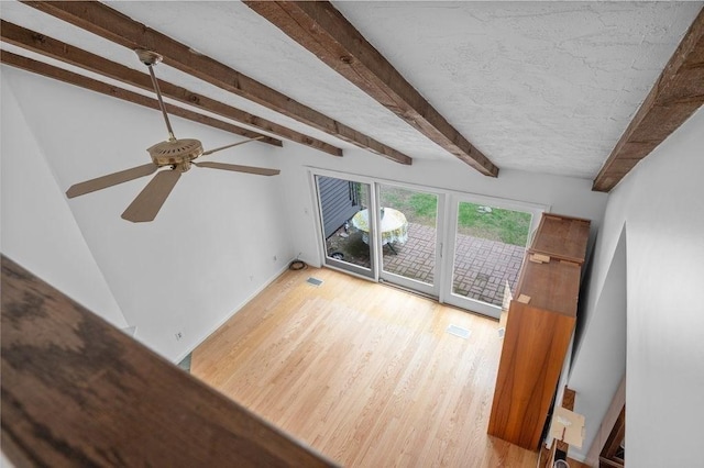 401 Colonial Dr Unit 35, Ipswich, MA 01938 - unfurnished living room with beam ceiling, light wood-type flooring, and ceiling fan