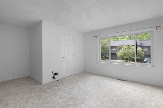 401 Colonial Dr Unit 35, Ipswich, MA 01938 - carpeted spare room featuring baseboards