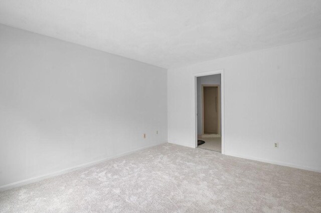 401 Colonial Dr Unit 35, Ipswich, MA 01938 - carpeted empty room with baseboards