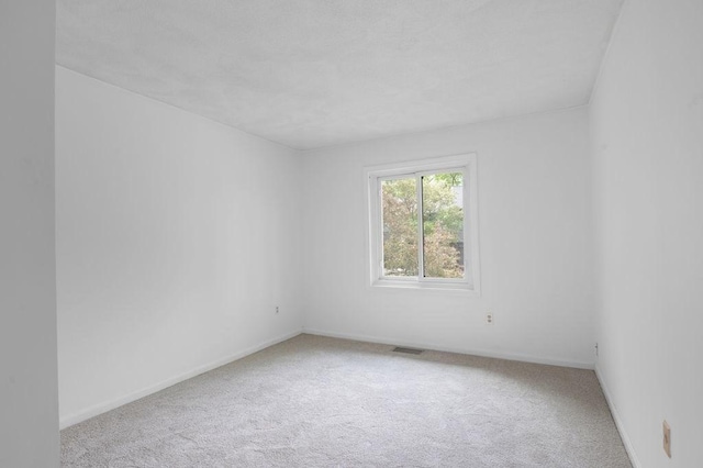 401 Colonial Dr Unit 35, Ipswich, MA 01938 - carpeted empty room featuring baseboards