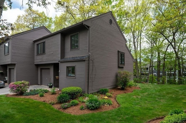 401 Colonial Dr Unit 35, Ipswich, MA 01938 - view of front of property with a front yard, an attached garage, and a patio