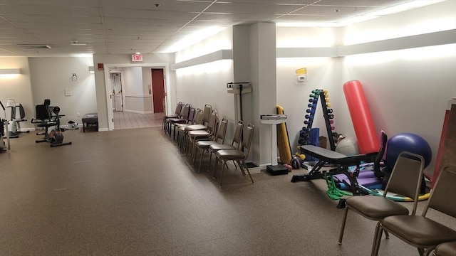 workout area featuring a drop ceiling