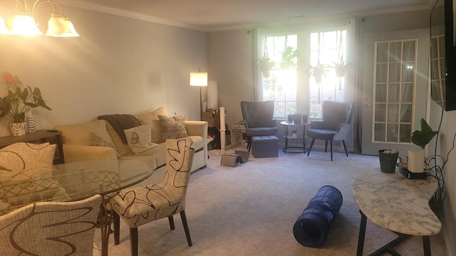 carpeted living room with a notable chandelier and crown molding