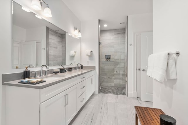 bathroom featuring vanity, hardwood / wood-style flooring, and a shower with door