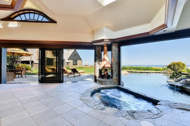 view of patio featuring an in ground hot tub