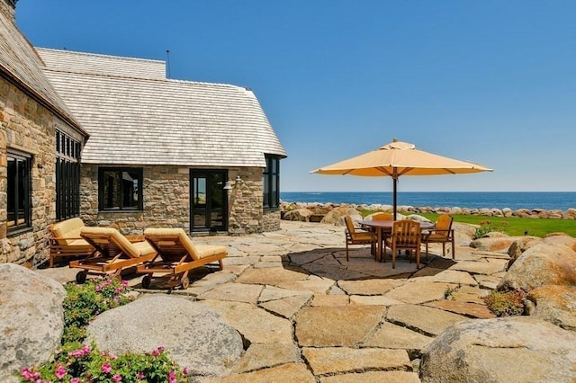 view of patio / terrace with a water view