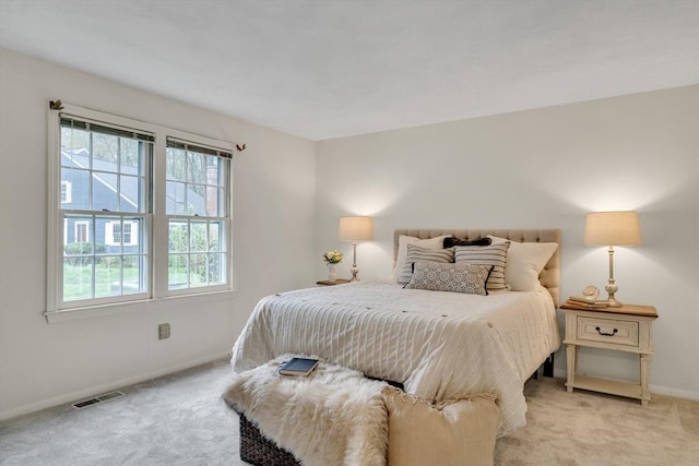 carpeted bedroom featuring baseboards