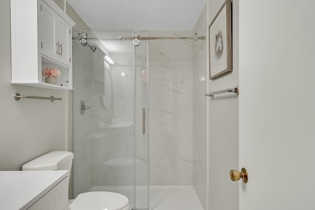 full bath with toilet, a marble finish shower, and vanity