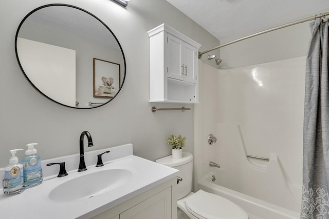 bathroom with vanity, toilet, and shower / bath combo with shower curtain