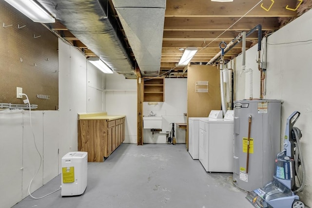 unfinished basement featuring independent washer and dryer and water heater