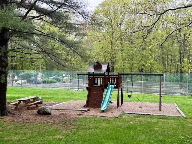 view of play area featuring a view of trees