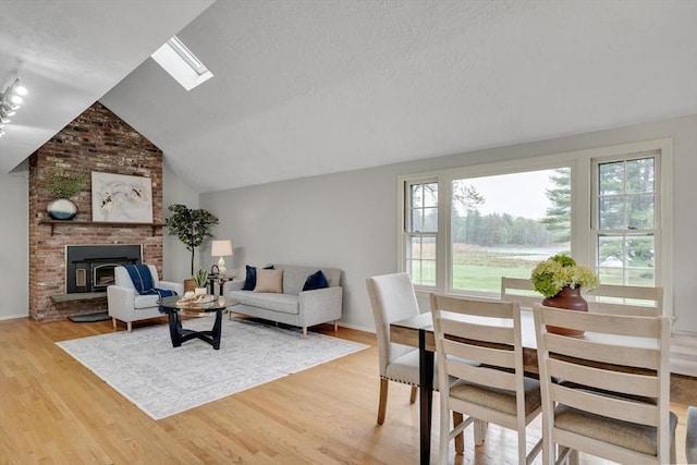 living room with lofted ceiling and light wood-type flooring