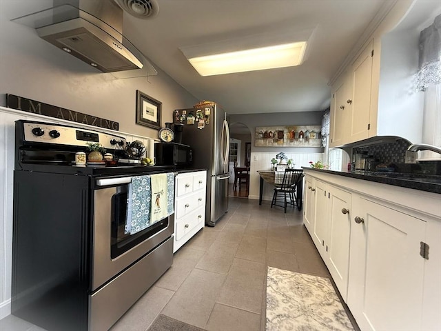 4 Perryville Rd, Webster, MA 01570 - kitchen with stainless steel appliances, exhaust hood, white cabinets, light tile patterned flooring, and a sink
