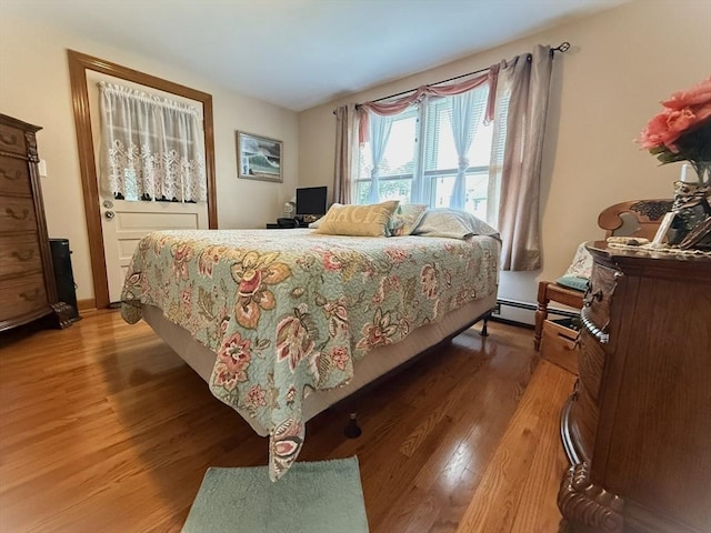 4 Perryville Rd, Webster, MA 01570 - bedroom with baseboard heating and light wood-style floors