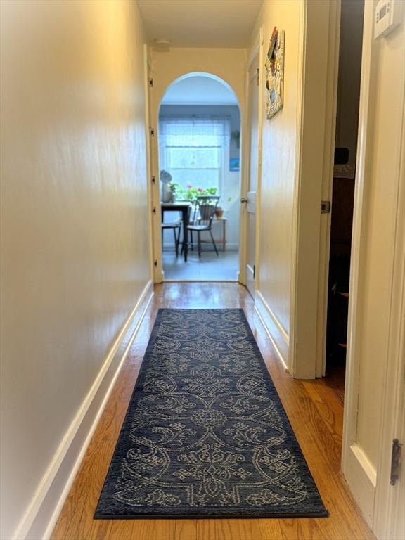 4 Perryville Rd, Webster, MA 01570 - hallway with arched walkways, wood finished floors, and baseboards