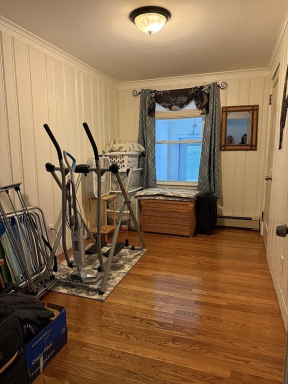 4 Perryville Rd, Webster, MA 01570 - exercise room featuring crown molding, a baseboard radiator, and wood finished floors