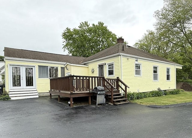 4 Perryville Rd, Webster, MA 01570 - rear view of property featuring a wooden deck, a chimney, french doors, and a shingled roof