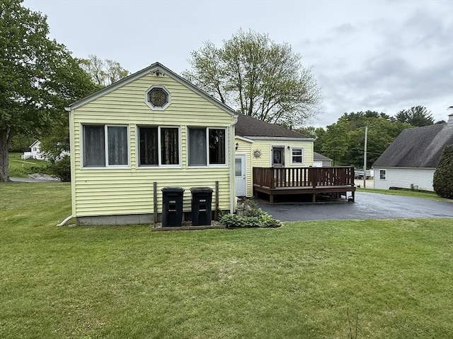 4 Perryville Rd, Webster, MA 01570 - back of property featuring a deck and a lawn