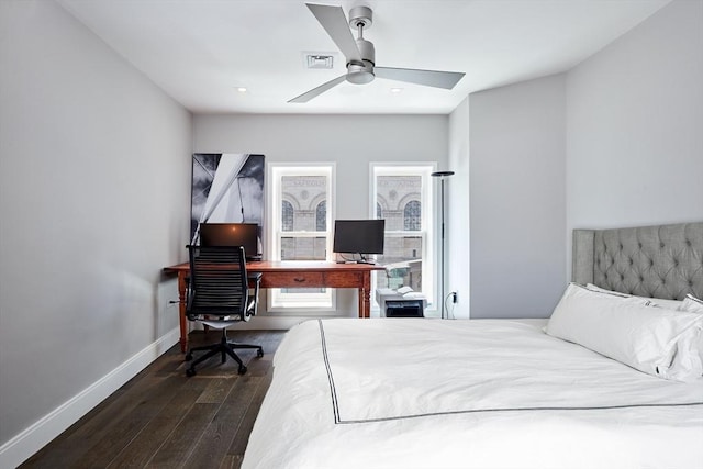 bedroom featuring ceiling fan and dark hardwood / wood-style floors